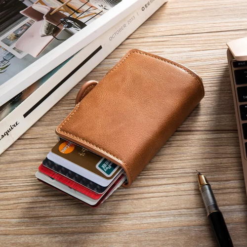 Brown pop-up card holder wallet with cards fanned out